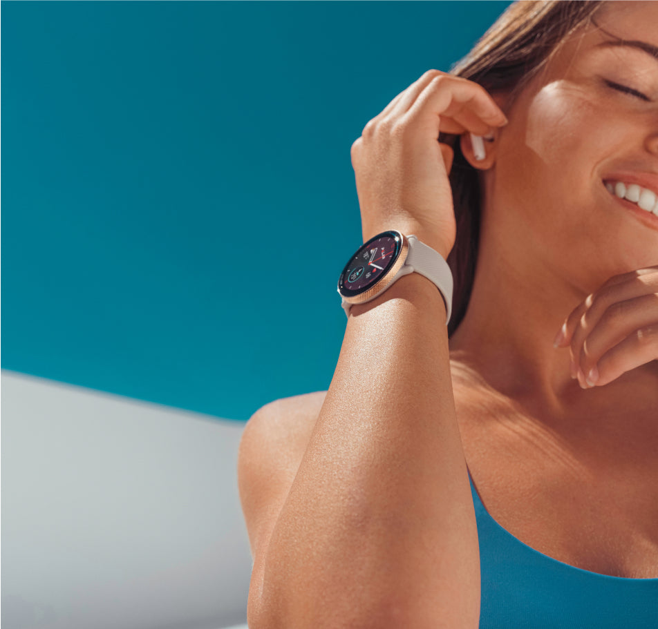 A woman wearing a smartwatch with an integrated pedometer