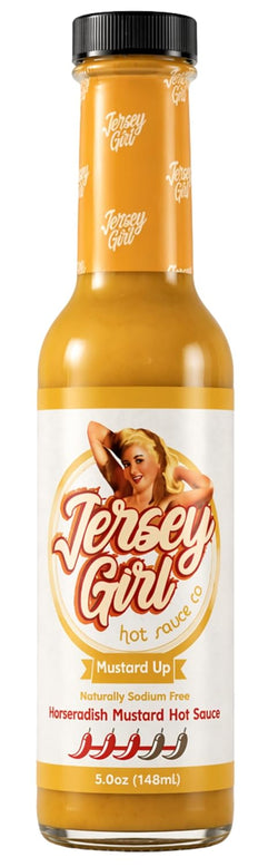 A bottle of Jersey Girl Hot Sauce, specifically the 'Mustard Up' horseradish mustard sauce. The bottle is filled with a golden-yellow sauce and features a retro-style white label with an illustration of a woman and the brand name 'Jersey Girl'.
