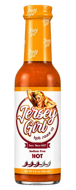 A bottle of Jersey Girl Hot Sauce on a plain white background. The bottle contains orange-red sauce and has a white label with orange and red text, featuring a retro illustration of a woman.